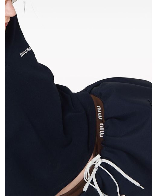 Minifalda con aplique del logo Miu Miu de color Blue