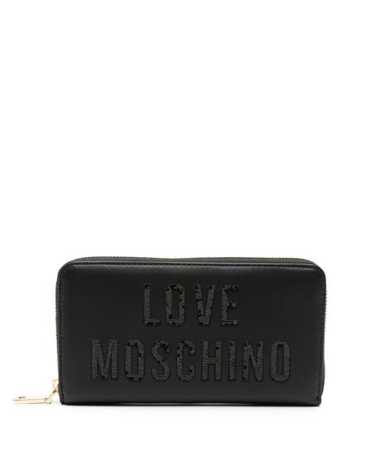 Portefeuille zippé à logo brodé de sequins Love Moschino en coloris Black