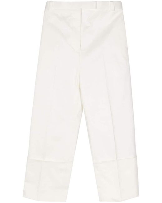 Pantaloni affusolati con pieghe di Thom Browne in White