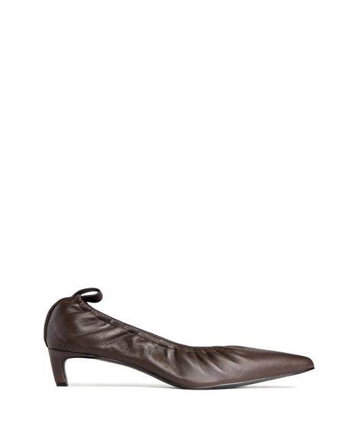 12 STOREEZ White Leather Pumps