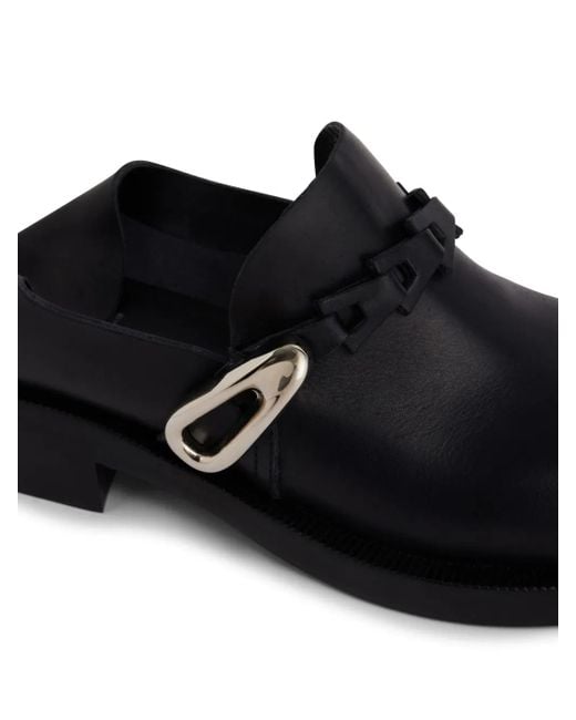 Mules di Rabanne in Black