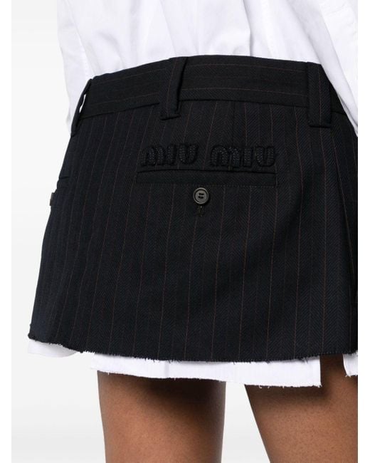 Minifalda a rayas diplomáticas Miu Miu de color Black
