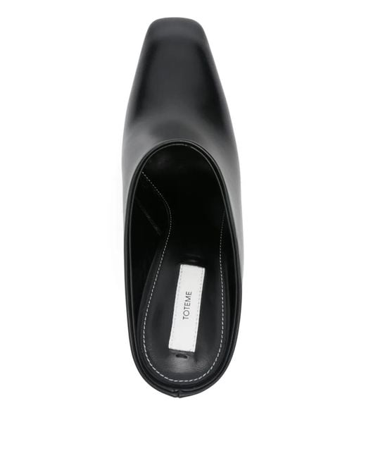 Mules con tacón de 85 mm Totême  de color Black