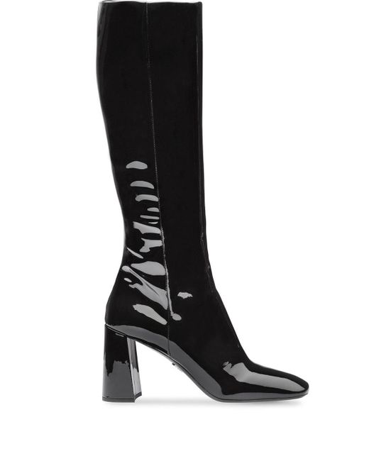 Bottes en cuir verni Prada en coloris Black