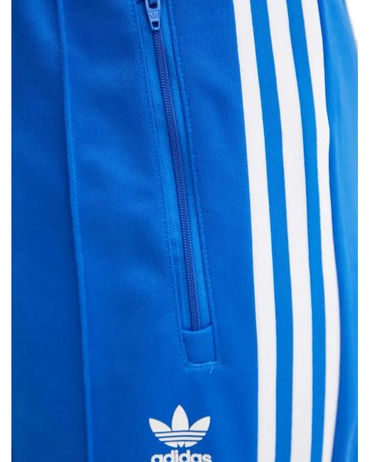 Pantalones de chándal con tres rayas Adidas de color Blue