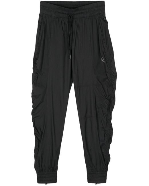 Pantalon à logo imprimé Adidas By Stella McCartney en coloris Black