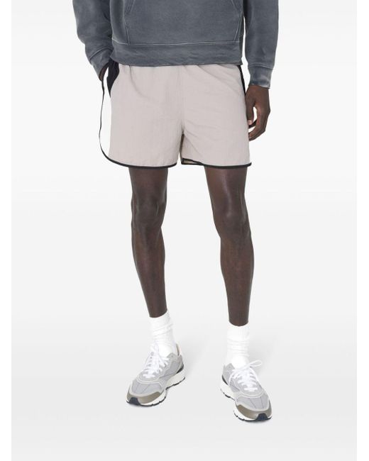Shorts con design color-block di John Elliott in White da Uomo