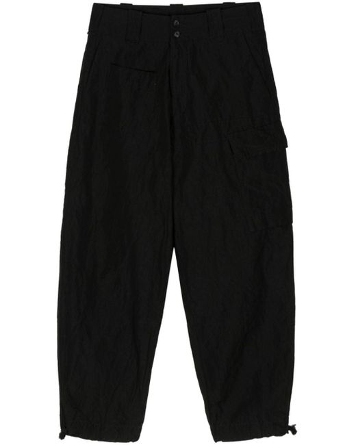 Mid-rise tapered trousers di Masnada in Black da Uomo