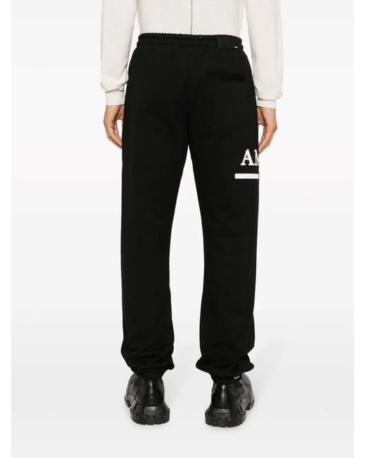 Amiri Black Logo-Engraved Cotton Track Trousers for men