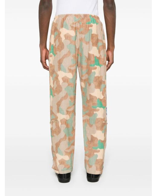 Pantaloni dritti con stampa camouflage di Acne in Natural da Uomo