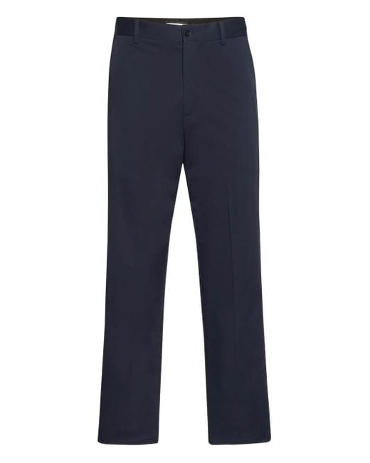 Philipp Plein Blue Logo-Plaque Trousers for men