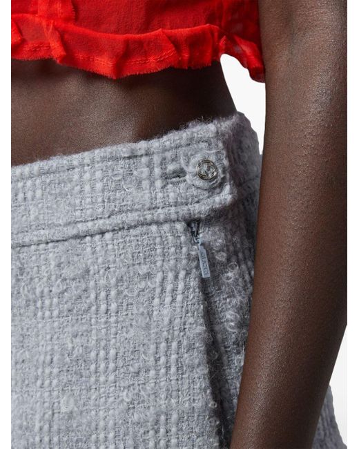 Minifalda de tweed Gucci de color Gray