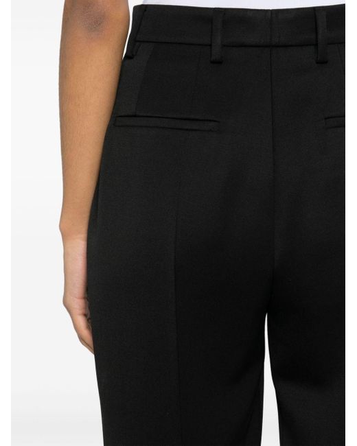 Pantaloni affusolati con pieghe di Prada in Black