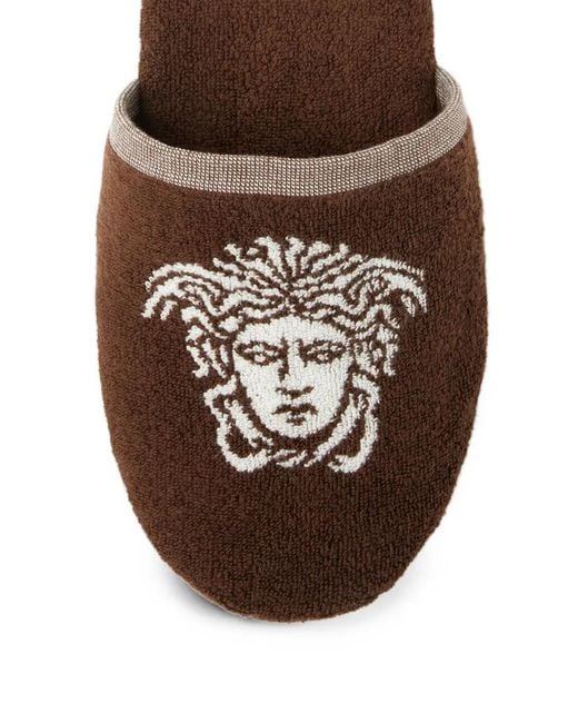 Slippers di Versace in Brown