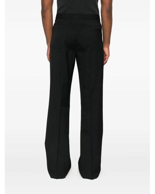 Amiri Black Button-Fly Bootcut Trousers for men