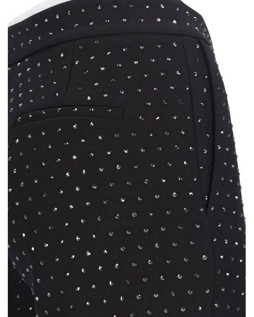 Pantalones rectos con apliques de cristales ANDAMANE de color Blue