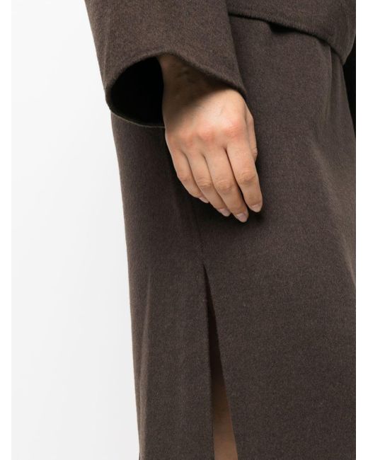Jupe mi-longue à coupe évasée Totême  en coloris Black