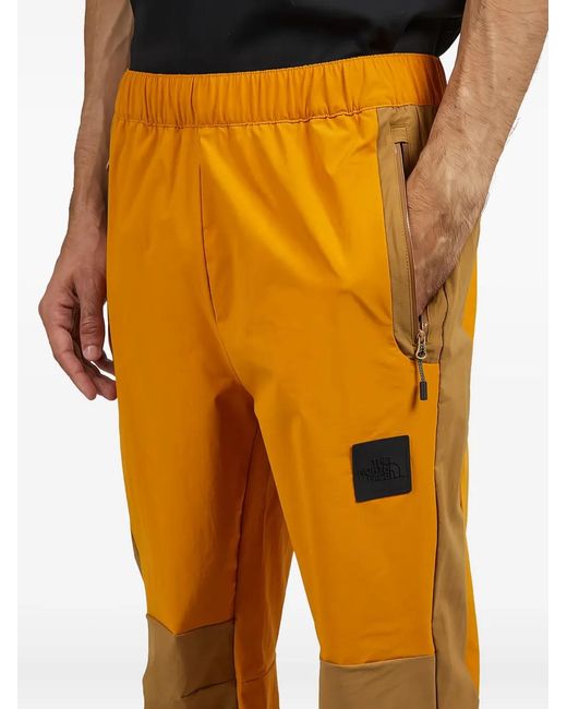 The North Face Yellow Lightweight Shell Trousers for men