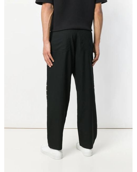 COMME DES GARÇON BLACK Blue Studded Chinos for men