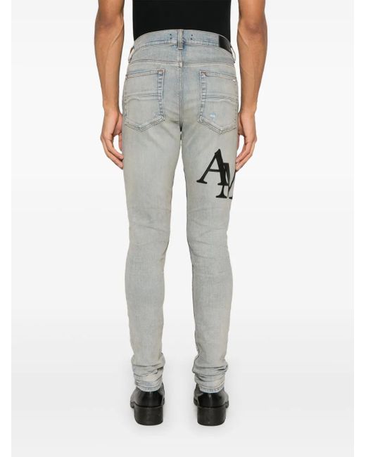 Amiri Blue Staggered Logo Skinny Jeans For for men