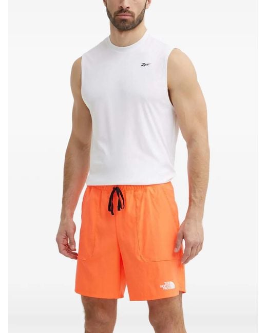 The North Face Orange Logo-Print Tack Shorts for men