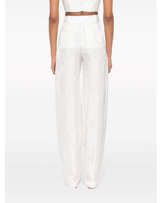 Pantalones con logo en jacquard The Attico de color White