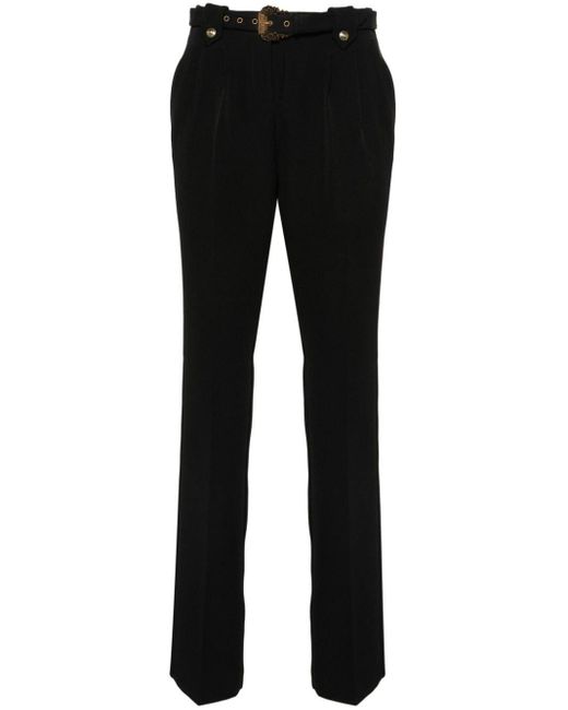 Pantalon fuselé à taille ceinturée Versace en coloris Black
