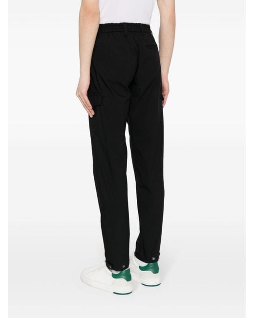 Pantaloni affusolati Tech di Calvin Klein in Black da Uomo