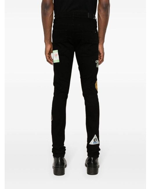 Amiri Black Travel Patch Repair Jeans for men