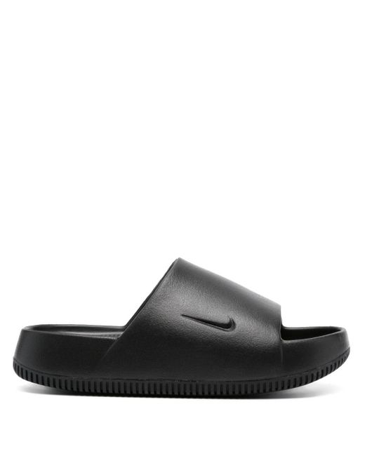 Nike Calm Swoosh-logo Flat Slides in Black | Lyst