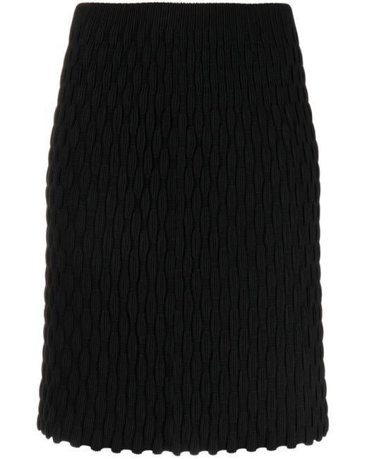 Jupe mi-longue à ourlet festonné JNBY en coloris Black