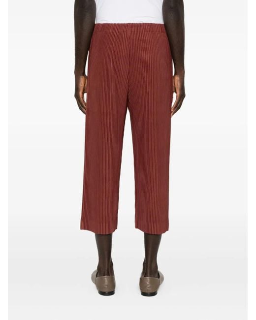 Homme Plissé Issey Miyake Red Pleated Cropped Trousers for men