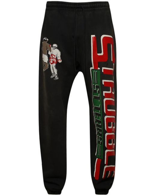 SAINT Mxxxxxx Black Logo-Print Cotton Track Pants for men