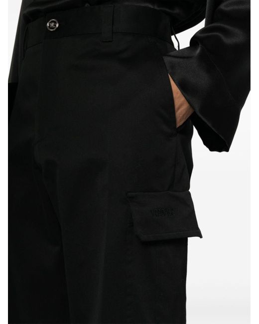Pantalon cargo à logo brodé Versace pour homme en coloris Black
