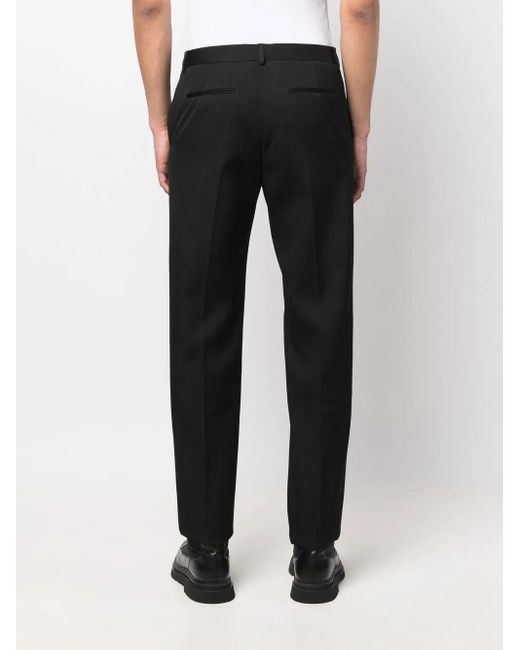 Valentino Garavani Black Pressed-Crease Tailored Trousers for men