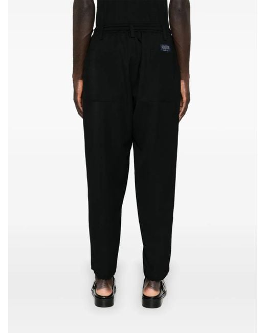 Yohji Yamamoto Black Elasticated Wool Tapered Pleated Trousers for men