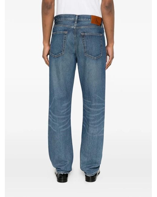 Calvin Klein Blue Logo-Patch Whiskered Jeans for men
