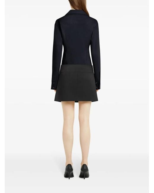 Minijupe Plissée À Taille Ceinturée Courreges en coloris Black