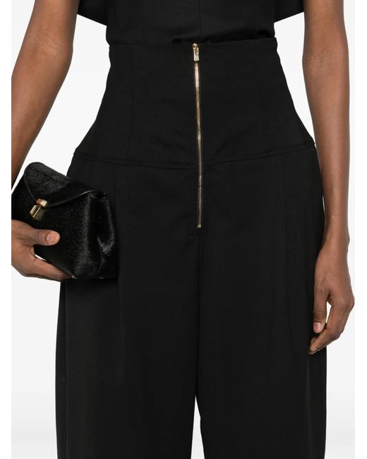 Pantalones ajustados con cremallera Thelatest de color Black