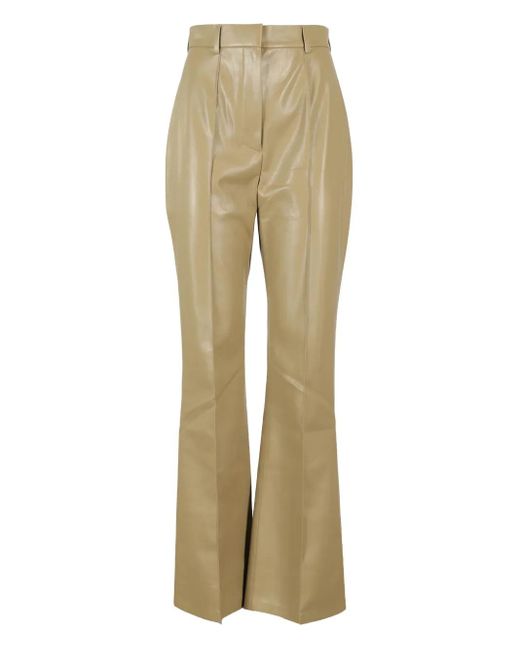 Pantalones acampanados con cierre oculto Nanushka de color Natural