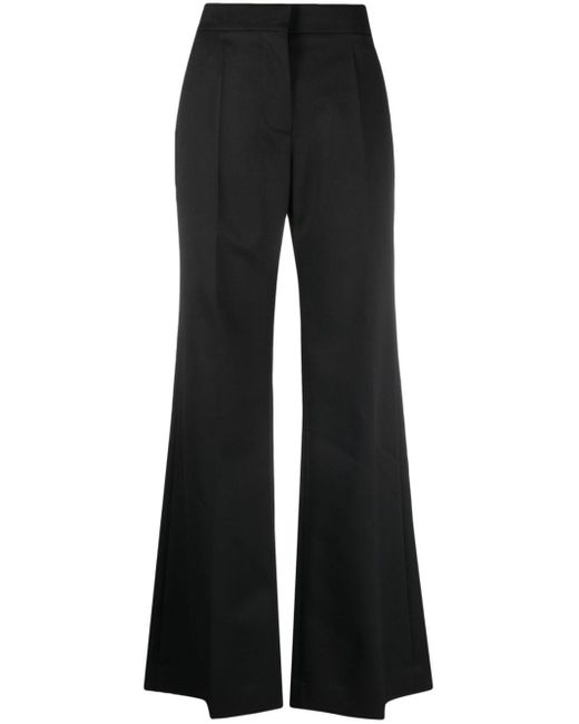Pantalon en laine à coupe évasée Givenchy en coloris Black