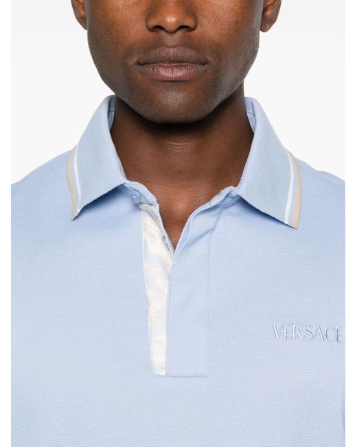 Polo à logo brodé Versace pour homme en coloris Blue