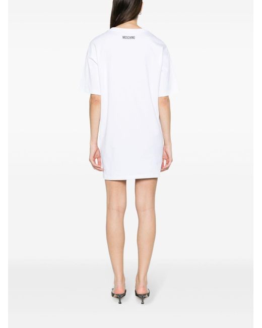 Vestido corto con texto estampado Moschino de color White