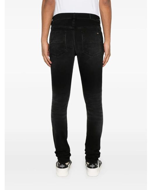 Amiri Black Distressed Skinny Jeans for men