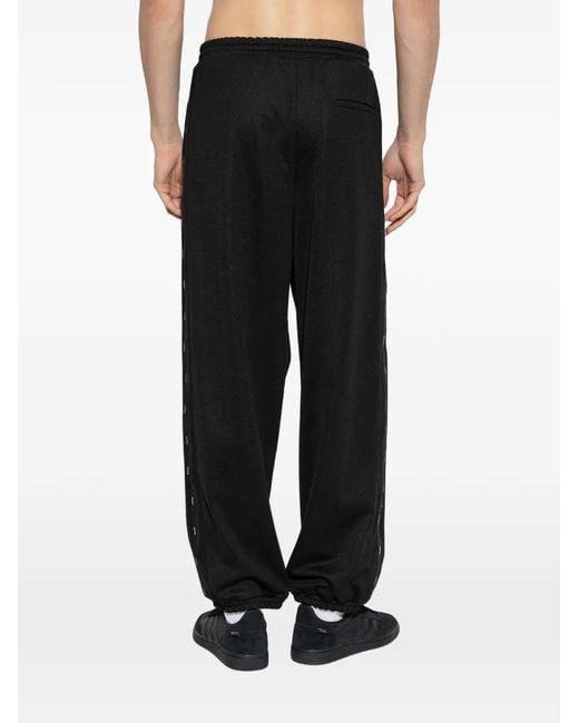 Moschino Black Logo Stripe Trousers for men