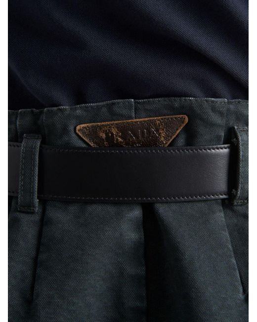 Minijupe en jean à coupe évasée Prada en coloris Black