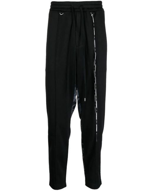 MASTERMIND WORLD Black Camouflage-Print Track Pants for men