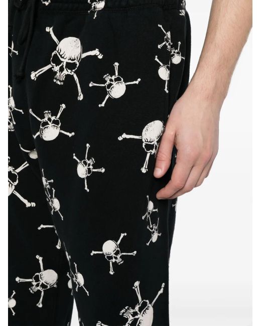 SAINT Mxxxxxx Black Skull-Print Cotton Track Pants for men