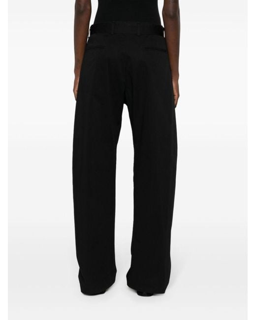 Pantalones anchos con cinturón Lemaire de color Black