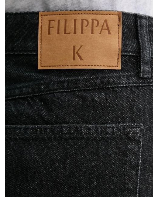 Minijupe À Patch Logo Filippa K en coloris Black